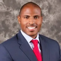 Aaron D Sims